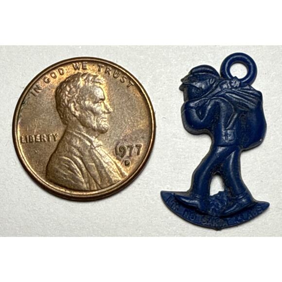 Vintage Cracker Jack Dark Blue Person Carrying Bag Charm 1G - Picture 1 of 2